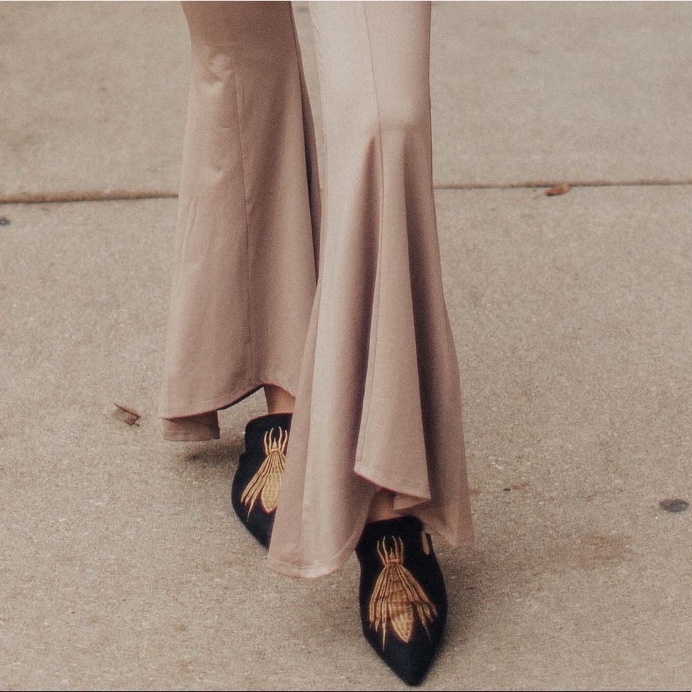 Black mules with bug design